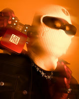 LUXFINE FAMILY urban brand lifestyle campaign photo, masked streetwear model showcasing signature hip hop jewelry collection